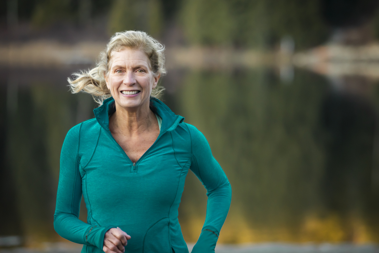 lady in a blue cardigan running