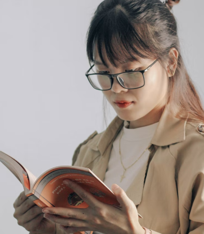 lady reads books with frames on