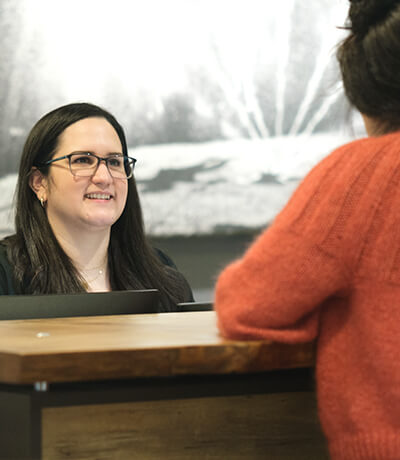 An image of two females talking