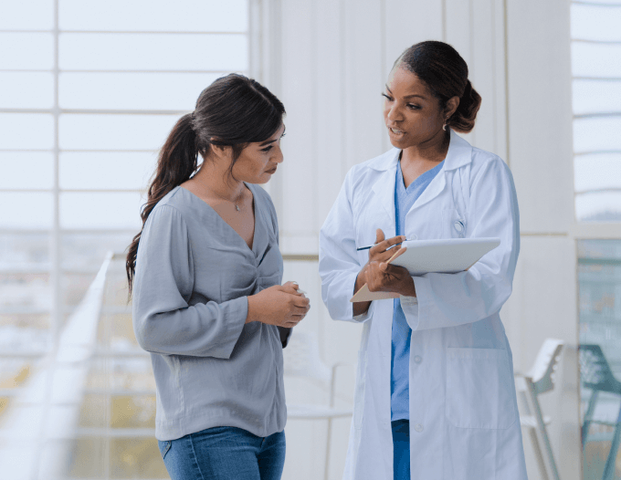 a lady consulting with a female doctor